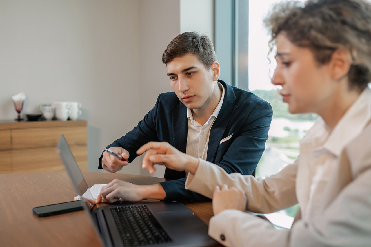 coworkers working on laptop