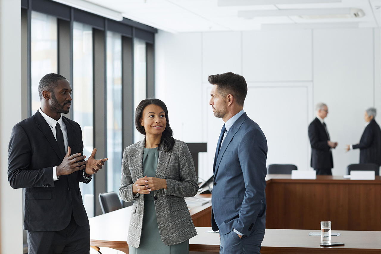 co-workers talking around conference room table